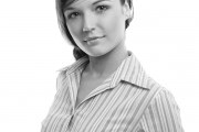 Positive business woman smiling over white background
